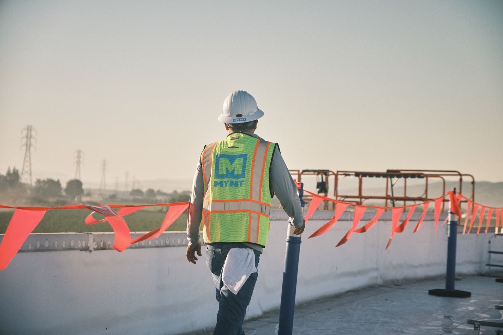 MYNT electrician working on a commercial solar installation